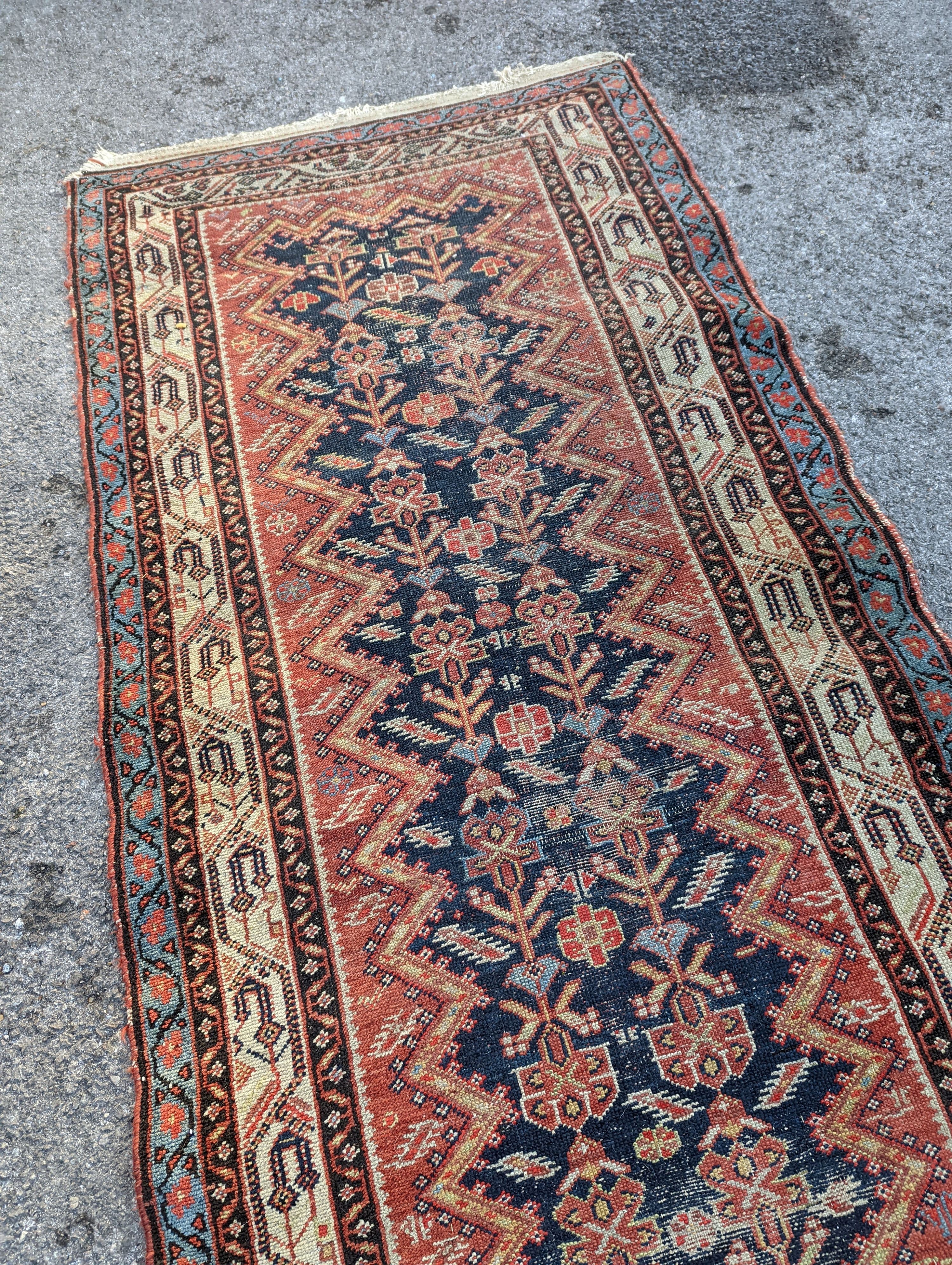 A Caucasian blue ground runner, 372 x 102cm